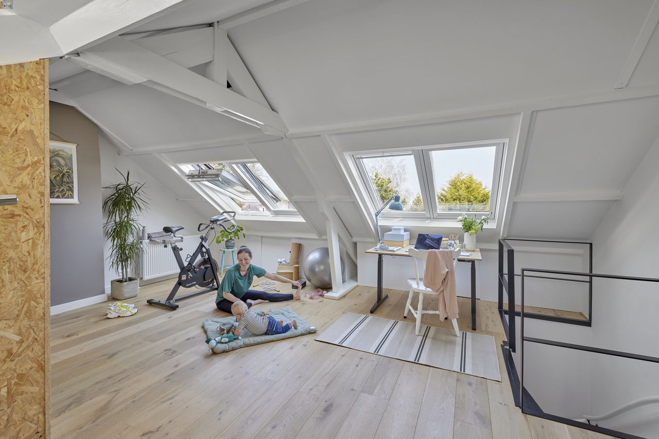 Woman and baby at home with VELUX roof windows