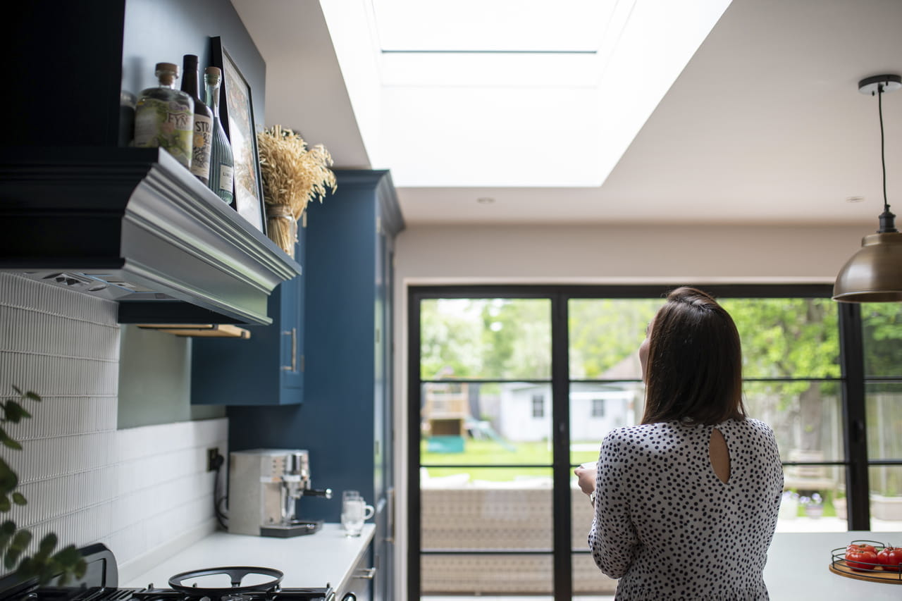 Joined kitchen and living room space with three roof windows