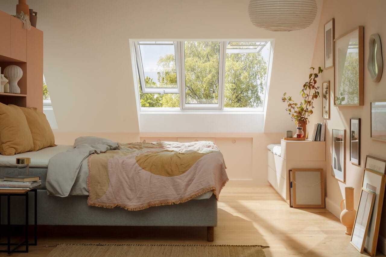 Bedroom with flat roof window just above the bed.